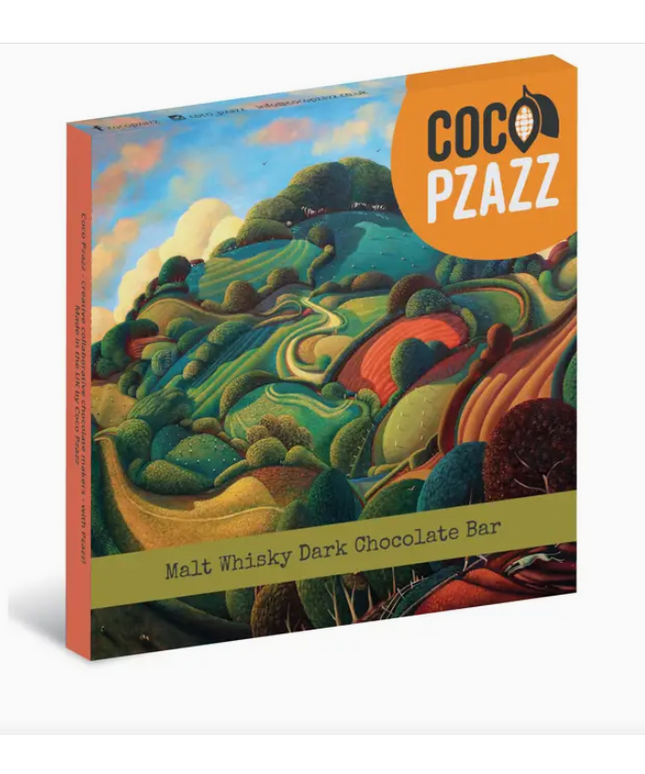 Coco Pzazz malt whisky dark chocolate bar packaging with a colorful landscape design.